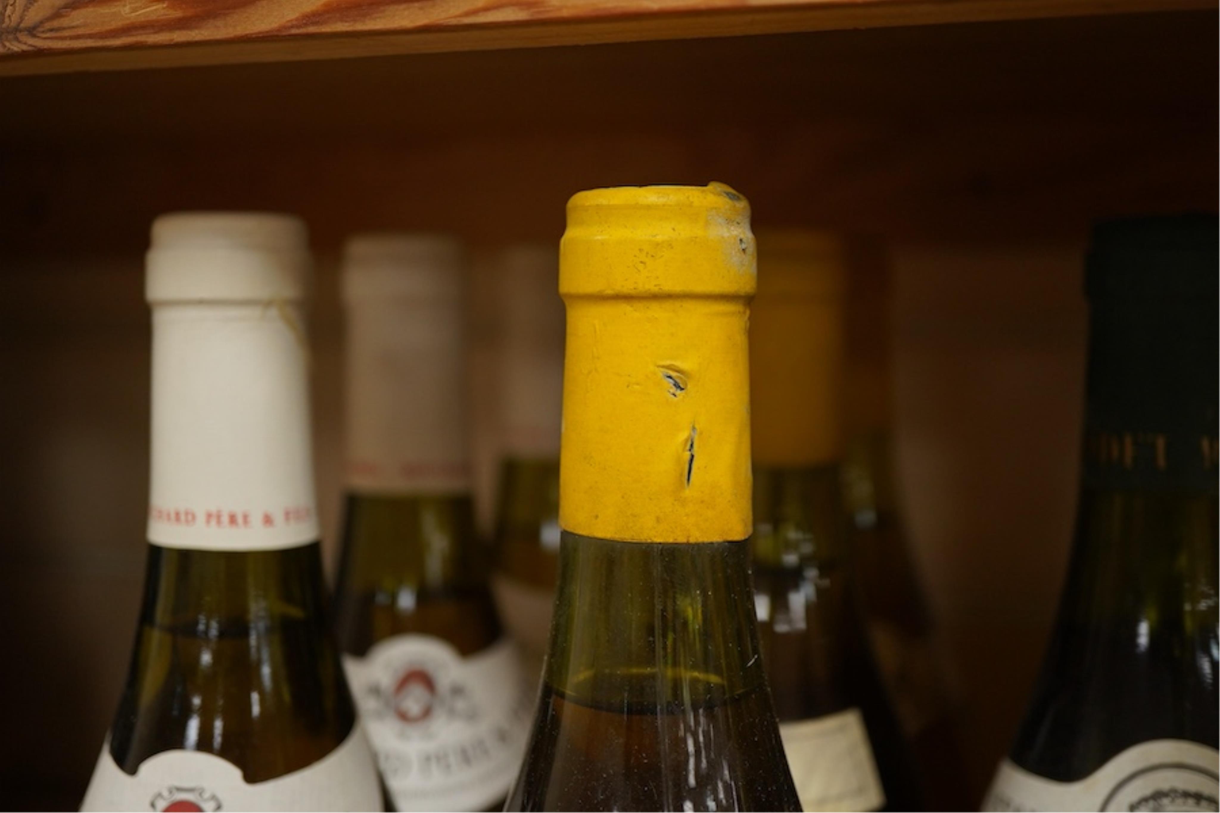 Eleven bottles of white burgundy including three Jean Chartron Puligny-Montrachet Premier Cru, 1985, two Antonin Rodet Meursault 1er Cru Perrieres, 1985, four various Puligny-Montrachet, a Domaine du Chateau de Meursault